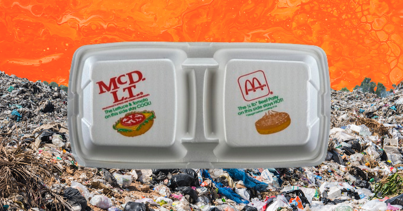 A McDonald’s McDLT box in front of a landfill on an orange background.